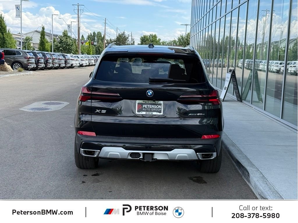 New 2026 Black Sapphire Metallic BMW xDrive50e image 4