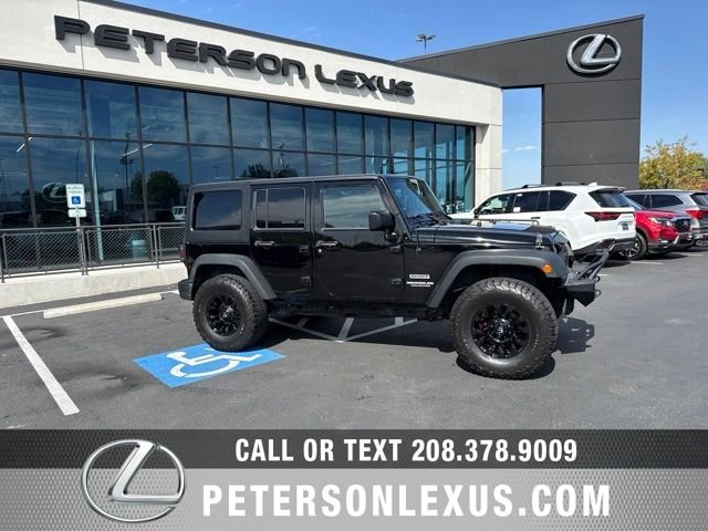 Used 2016 Black Jeep Unlimited Sport image 1