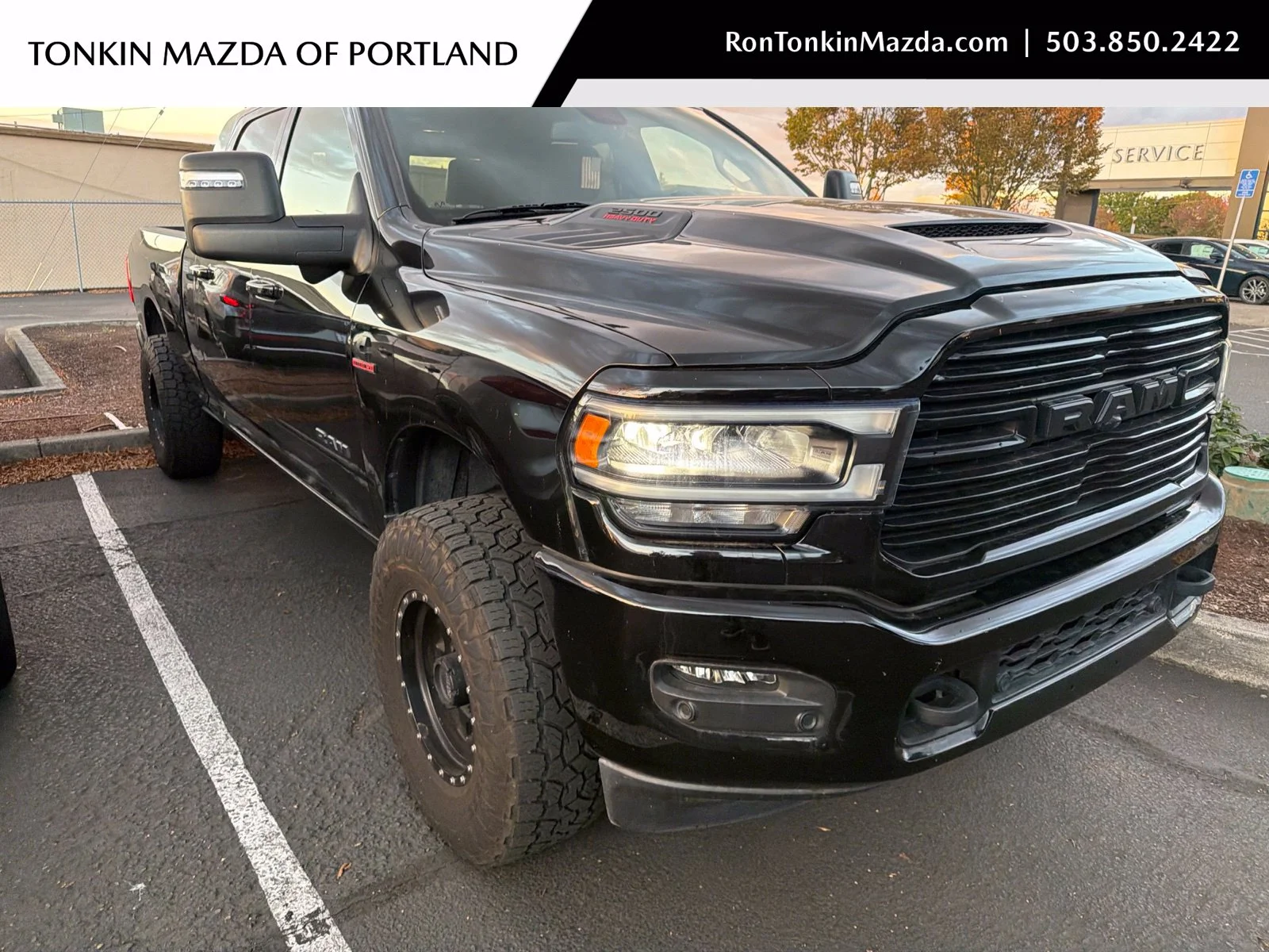 Used 2024 Diamond Black Crystal Pearlcoat Ram Laramie image 1