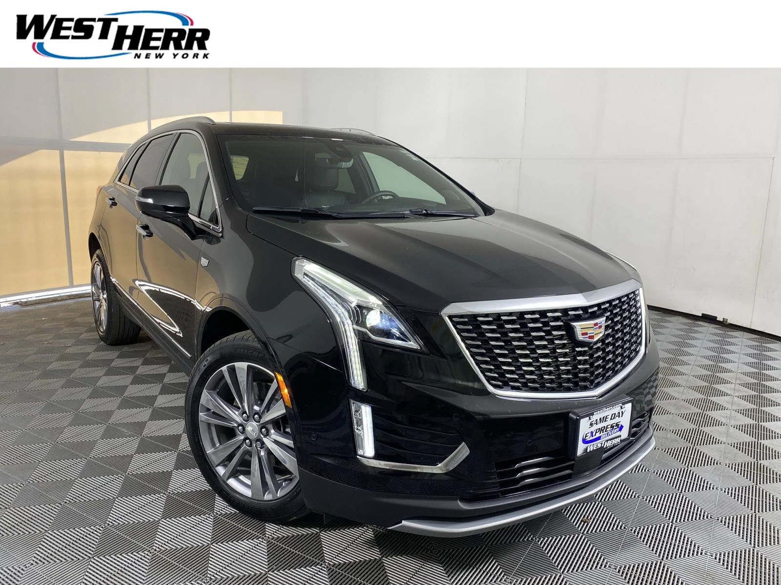 Used 2025 Stellar Black Metallic Cadillac AWD Premium Luxury image 1