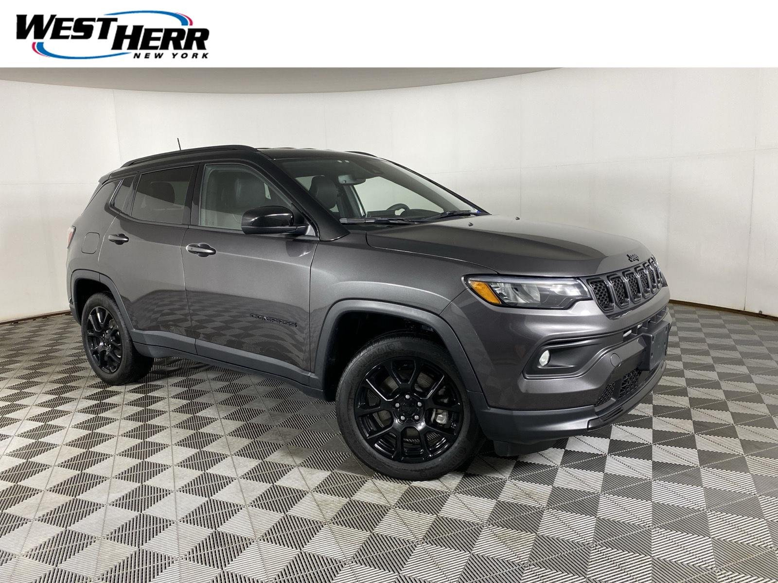 Used 2023 Granite Crystal Metallic Clearcoat Jeep Altitude image 1