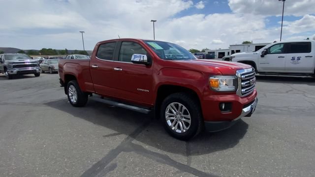 Used 2016 COPPER RED METALLIC GMC 4WD SLT image 2