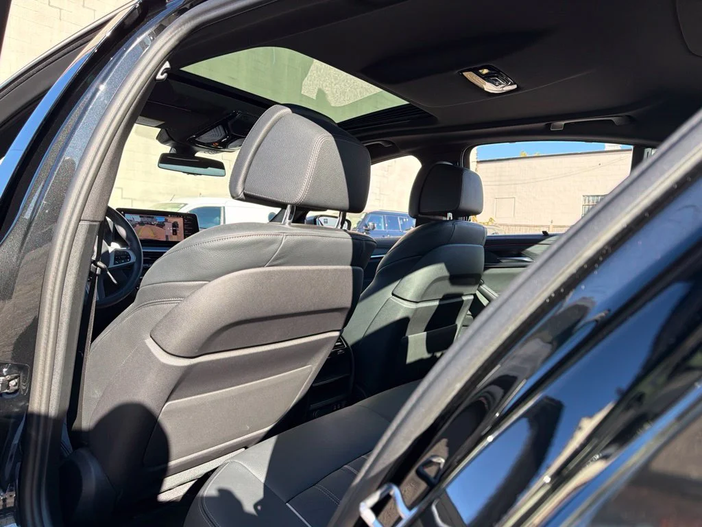Used 2023 Black BMW M550i xDrive image 22