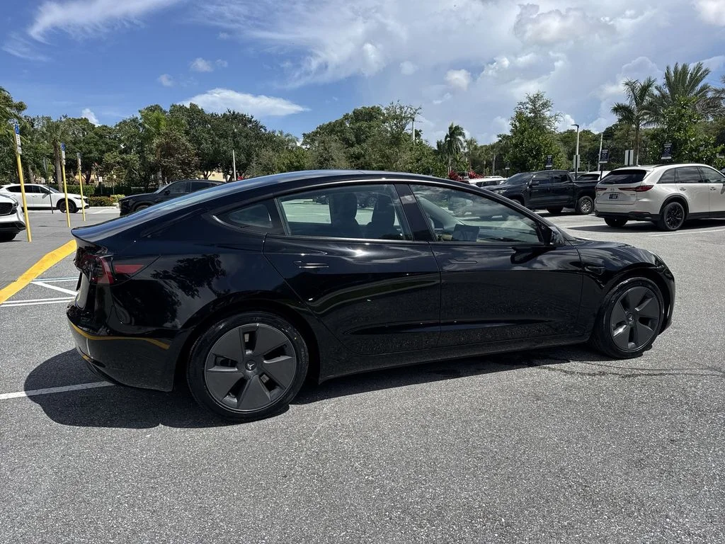 Used 2023 Solid Black Tesla  image 4