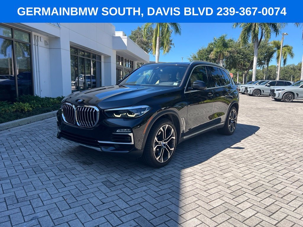 Used 2021 Black Sapphire Metallic BMW sDrive40i image 1