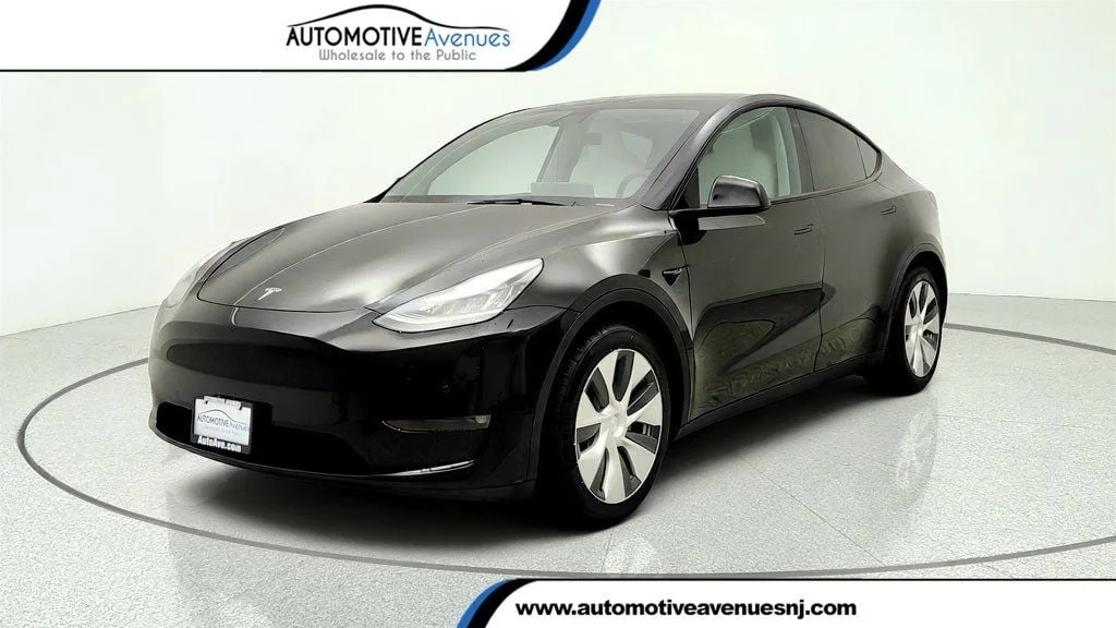 Used 2021 Solid Black Tesla Long Range AWD w/ White/Black 7-Seat Interior image 1