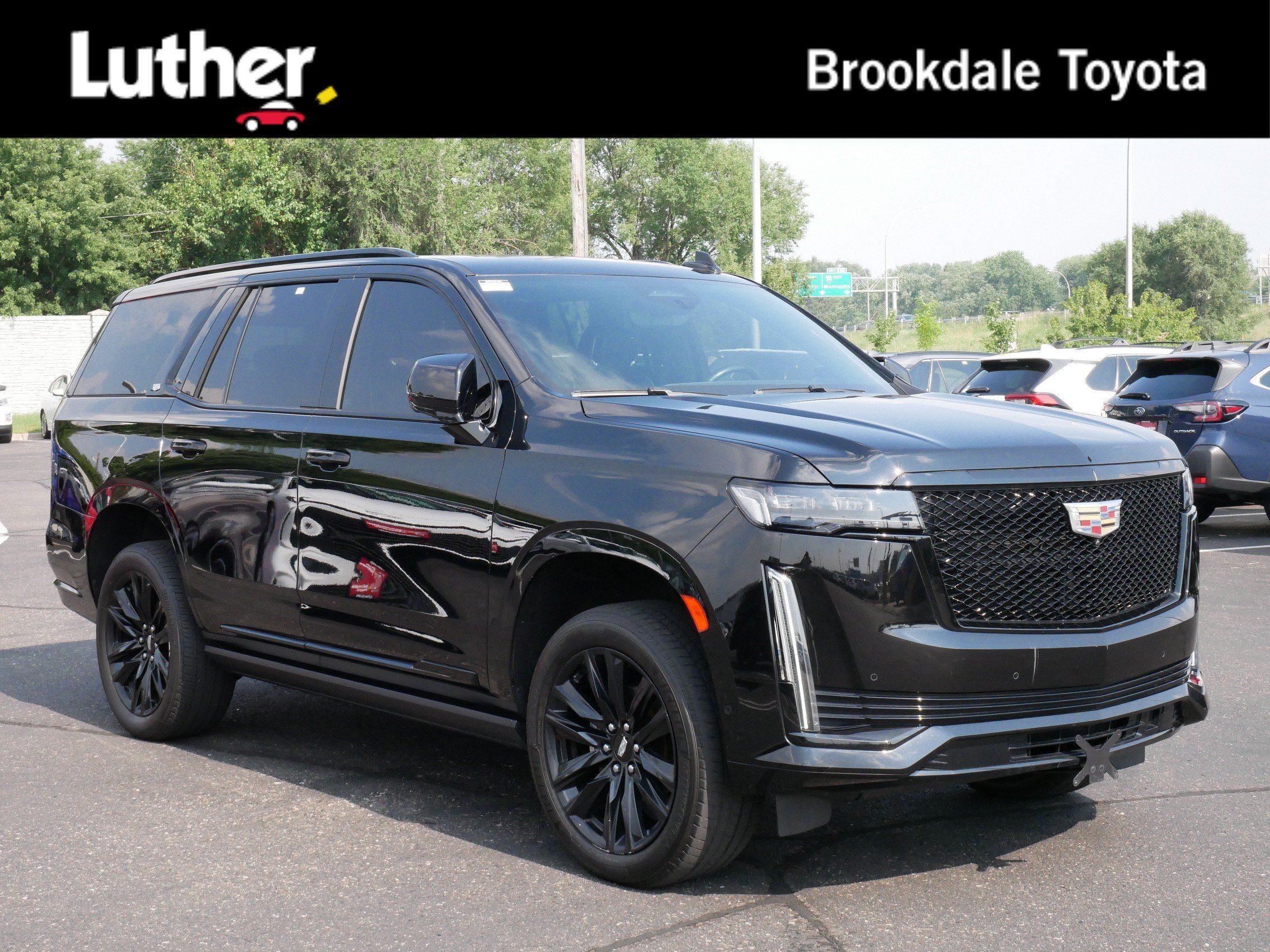 Used 2023 Black Raven Cadillac 4WD Sport image 1