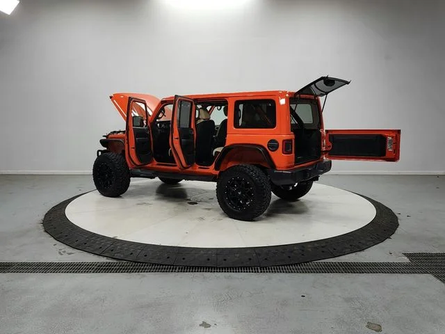 Used 2018 Orange Jeep Unlimited Sahara image 13