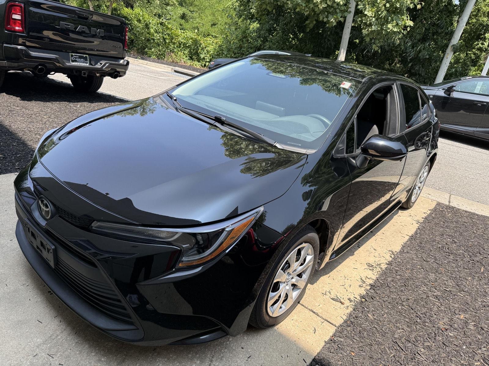 Used 2023 Midnight Black Metallic Toyota LE image 3