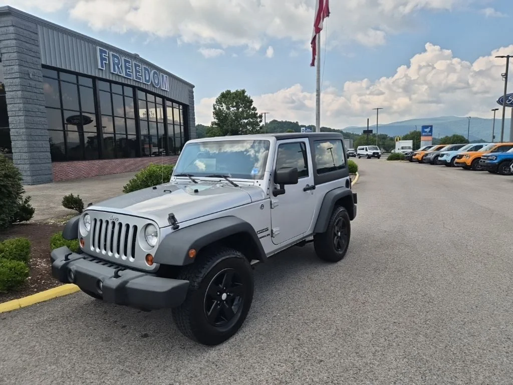 Used 2012 Bright Silver Metallic Jeep Sport image 1