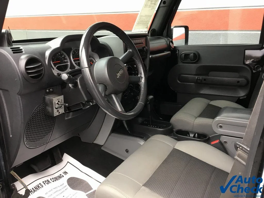 Used 2010 Black Jeep Unlimited Sport image 14
