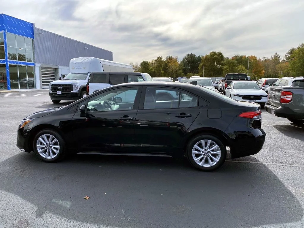 Used 2025 Midnight Black Metallic Toyota LE image 6