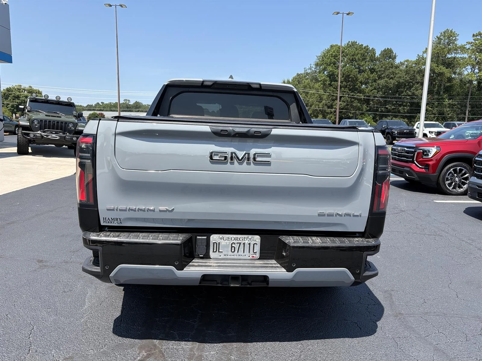 Used 2025 Thunderstorm Gray GMC Max Range Denali image 6