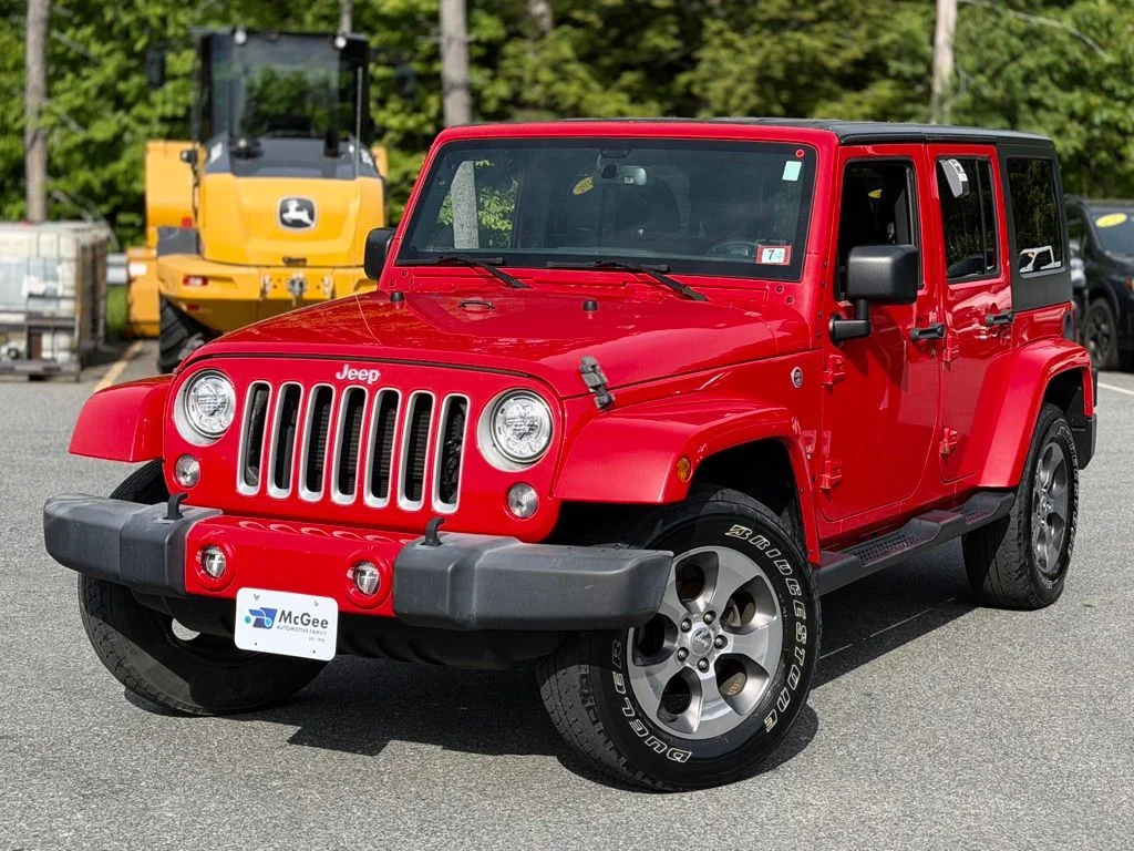 Used 2018 Red Jeep Unlimited Sahara image 1
