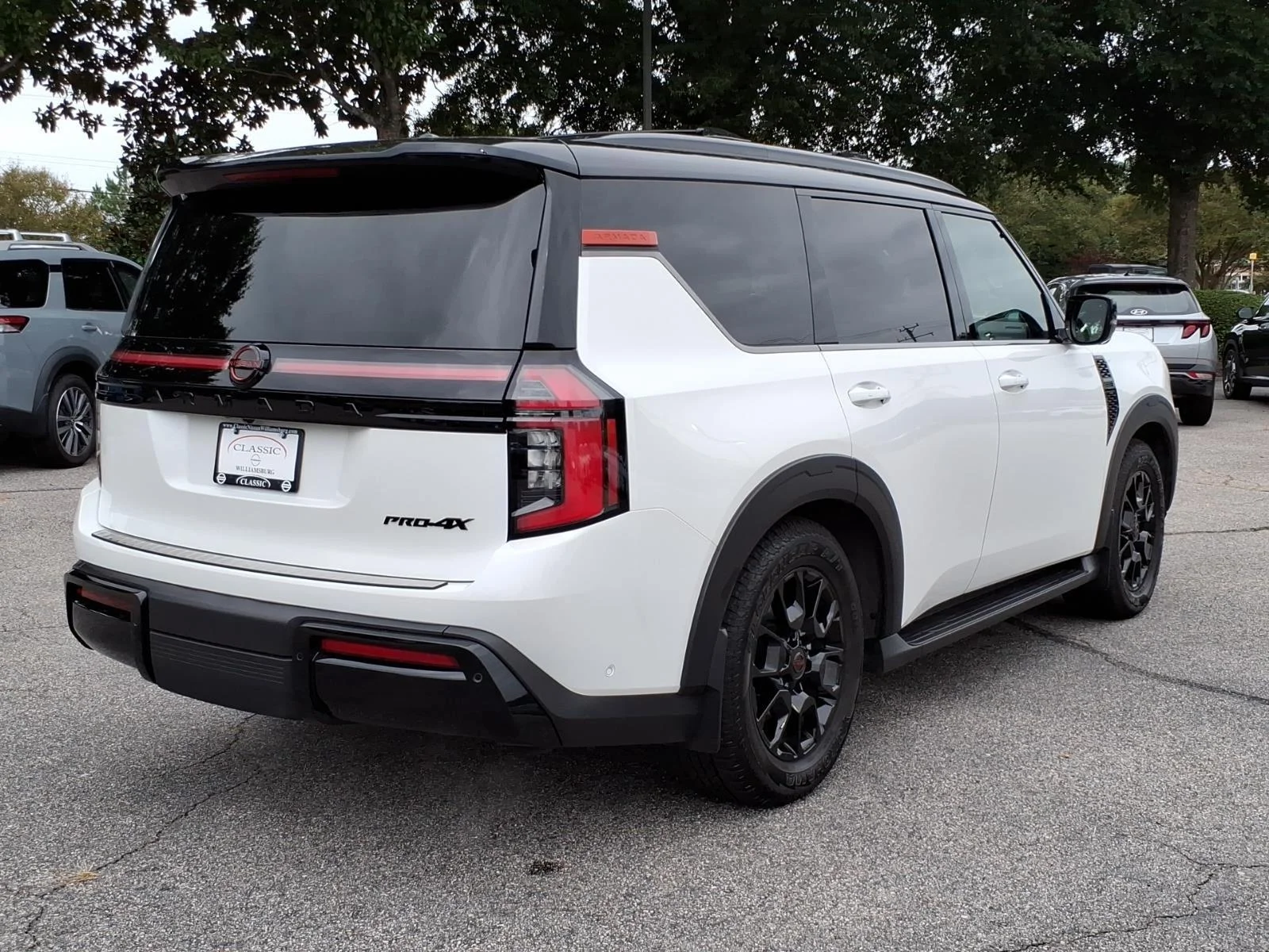 Used 2025 Aspen White Tricoat/Super Black Nissan PRO-4X image 7