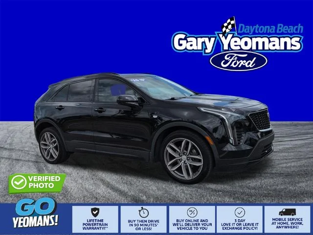 Used 2019 Stellar Black Metallic Cadillac Sport image 1