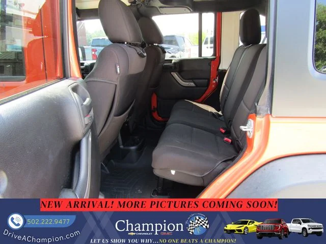 Used 2015 Orange Jeep Unlimited Sport image 9