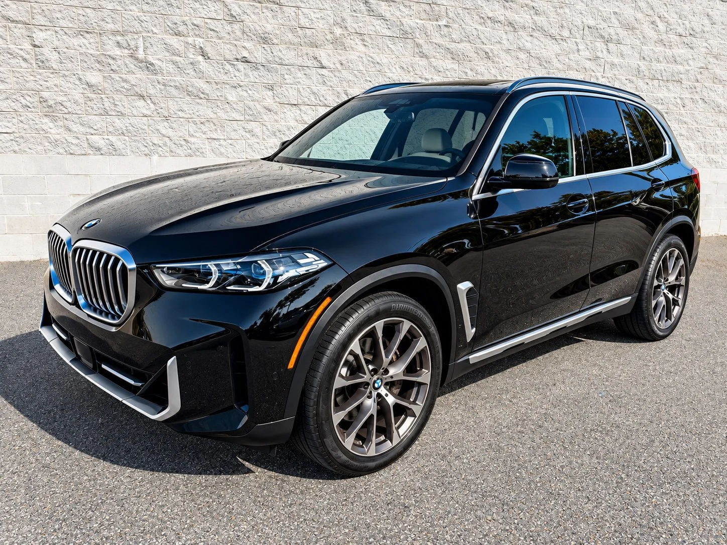 Certified Used 2025 Black Sapphire Metallic BMW xDrive40i image 1