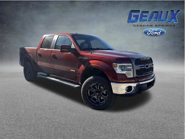 Used 2014 Orange Ford Lariat image 1