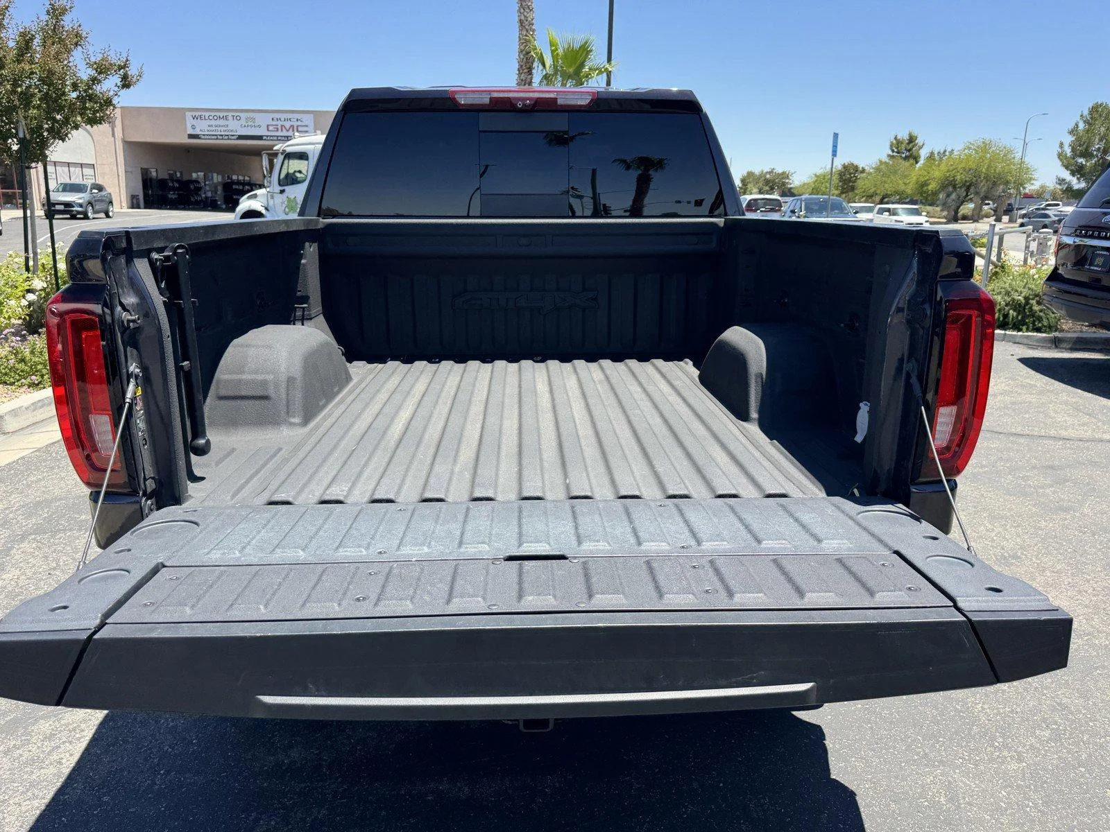 Used 2024 Titanium Rush Metallic GMC AT4X image 13
