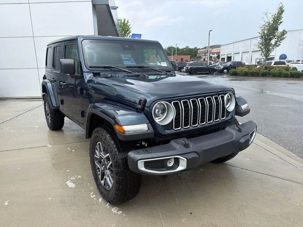 Used 2025 Fathom Blue Pearlcoat Jeep Sahara image 1
