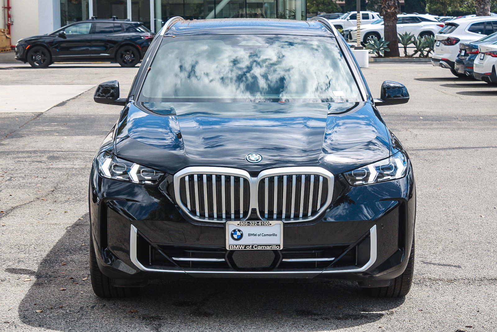 Used 2026 Black Sapphire Metallic BMW xDrive50e image 2