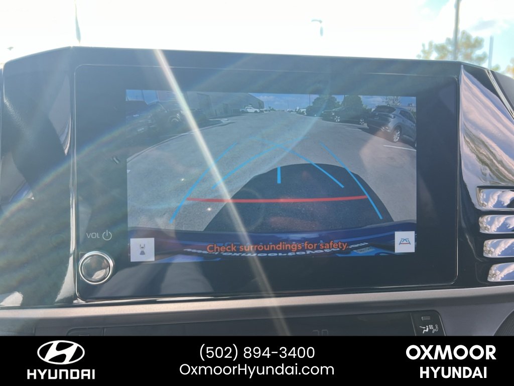 Used 2025 Reservoir Blue Toyota LE image 14