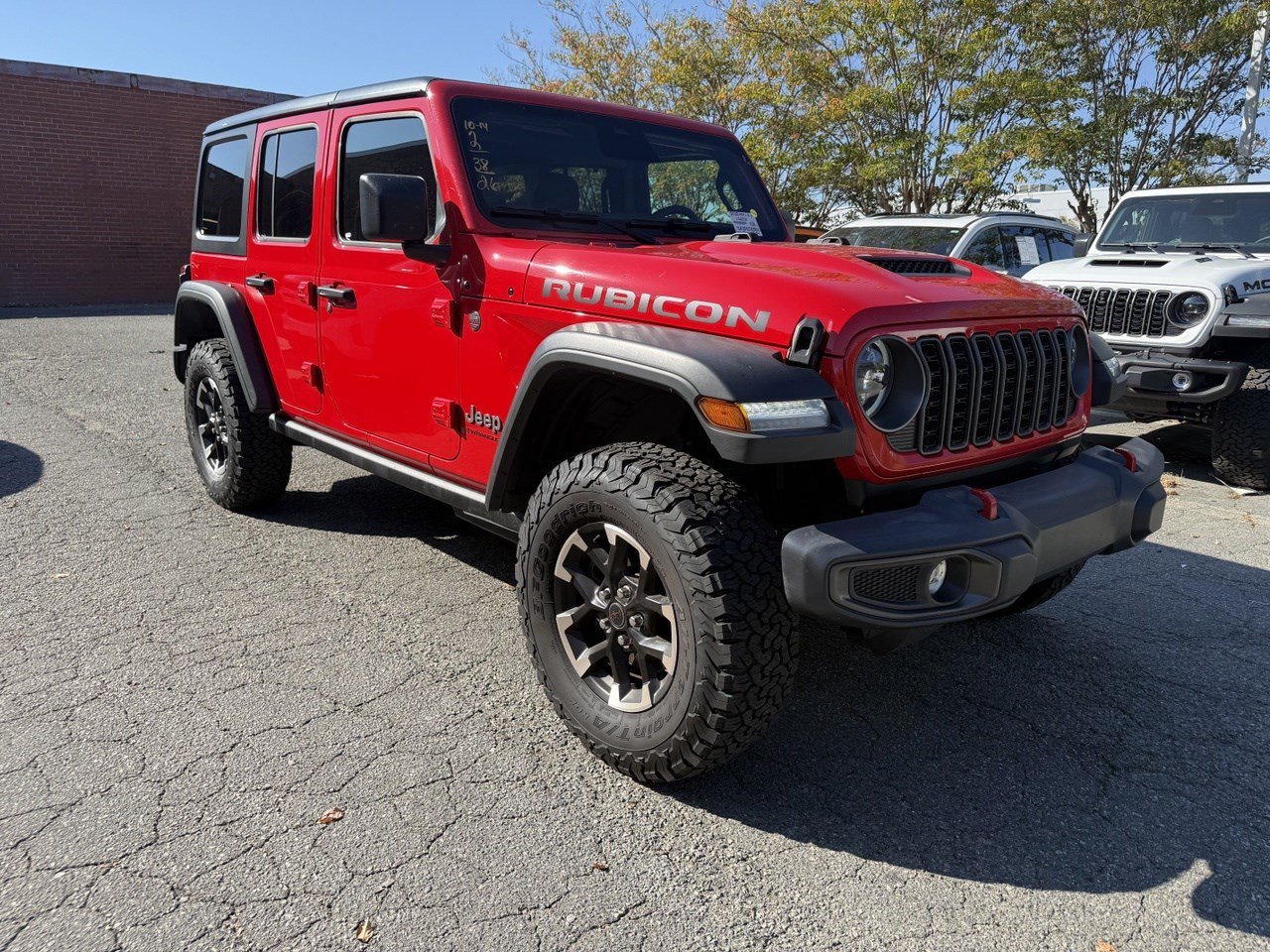 Used 2026 Firecracker Red Clearcoat Jeep Rubicon image 1