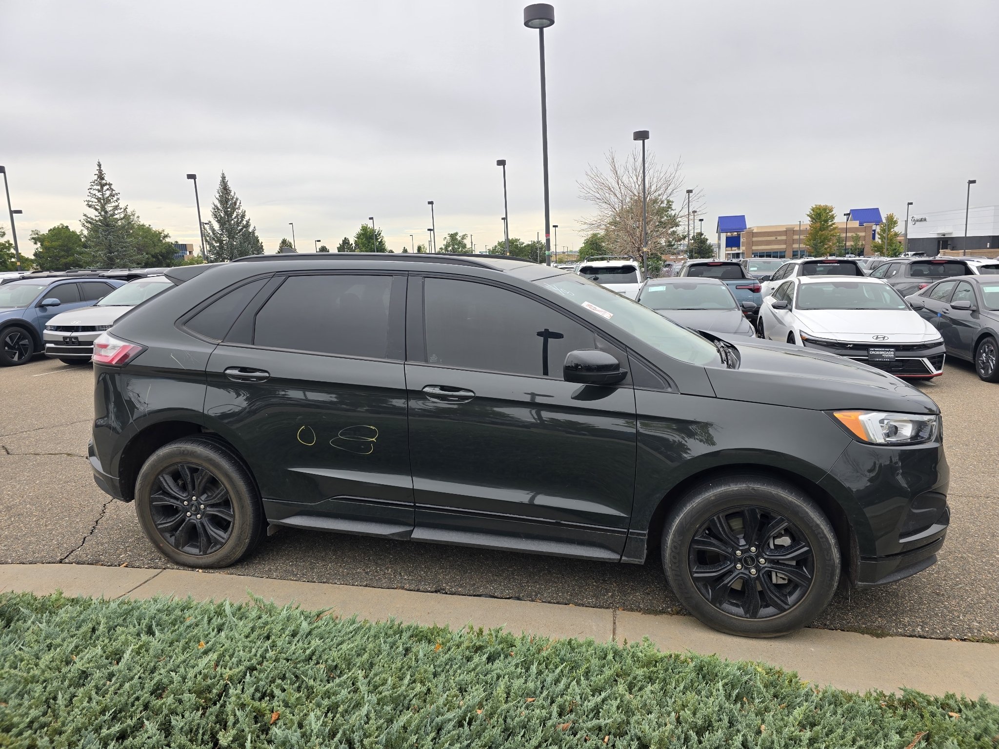 Used 2024 Forged Green Metallic Ford SE image 6