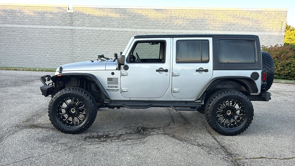 Used 2013 Billet Clearcoat Metallic Jeep Unlimited Sport image 4