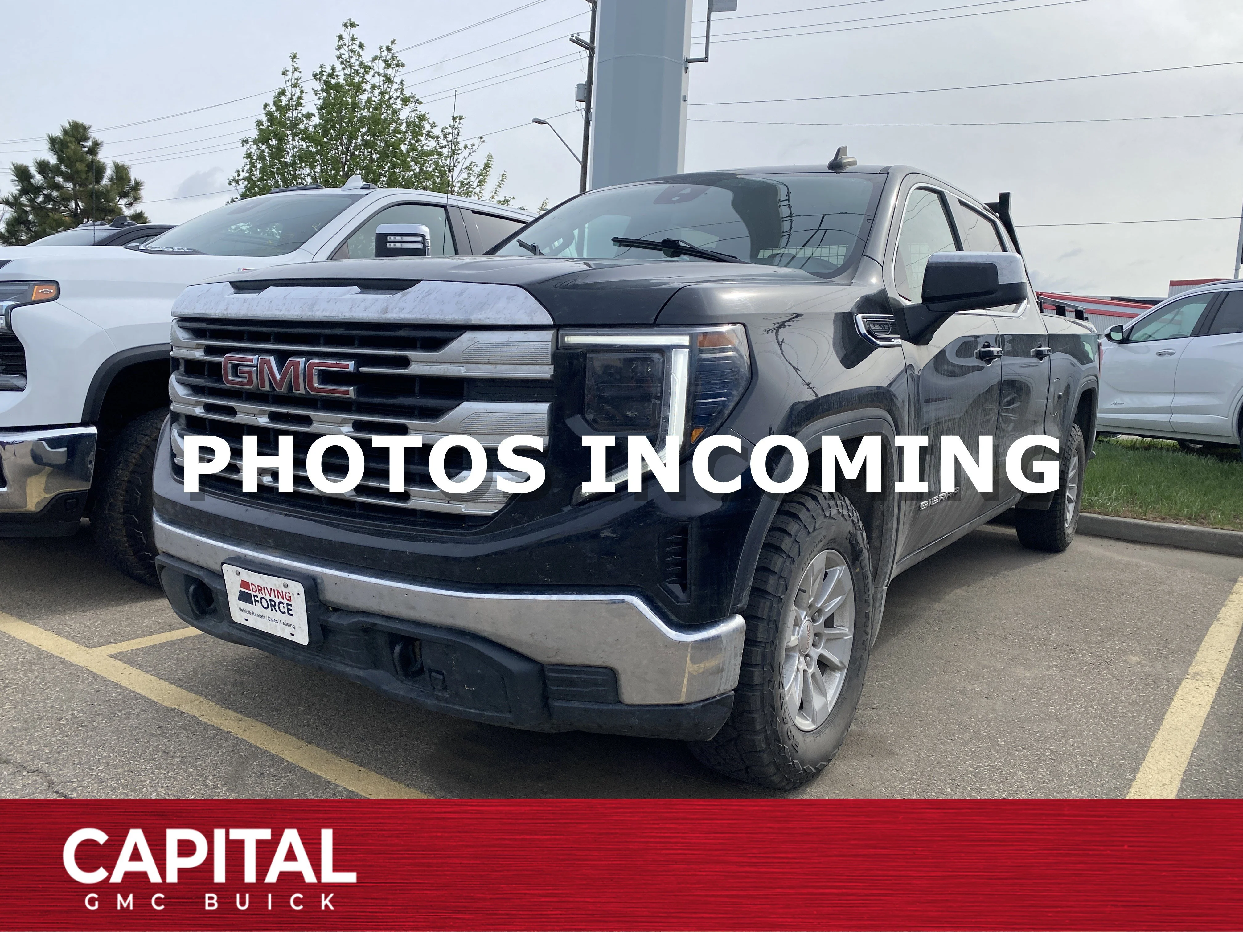 Used 2022 Black GMC Crew Cab SLE image 1