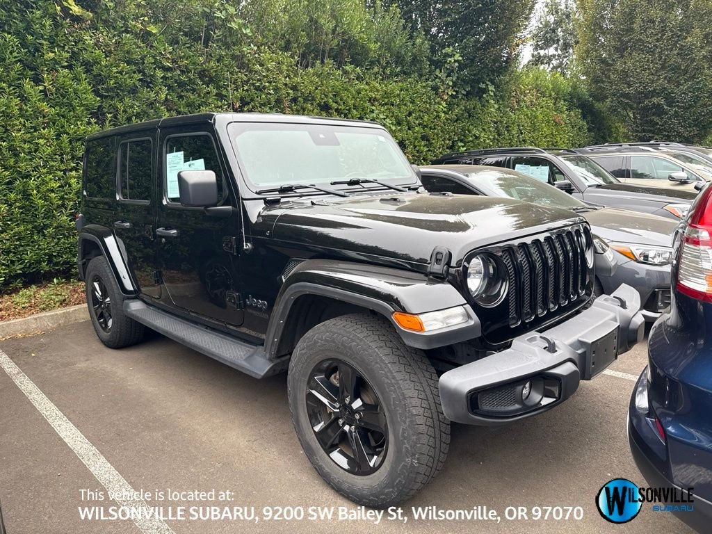 Used 2022 Black Jeep Unlimited Sahara Altitude image 1