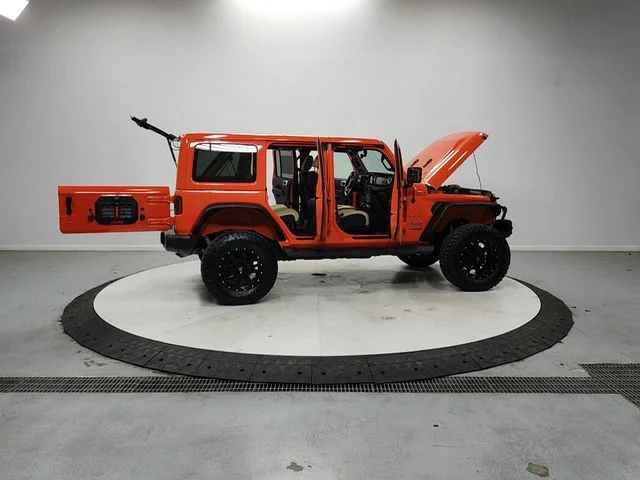 Used 2018 Orange Jeep Unlimited Sahara image 16