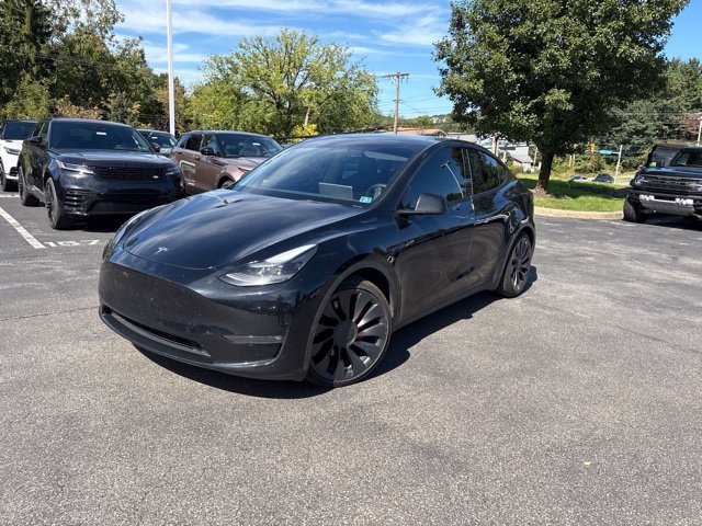 Used 2023 Solid Black Tesla Performance image 1