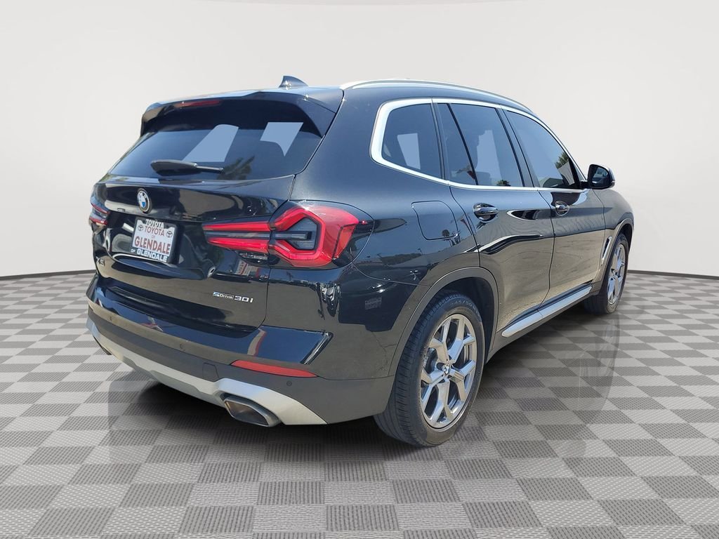 Used 2024 Black Sapphire Metallic BMW sDrive30i image 4