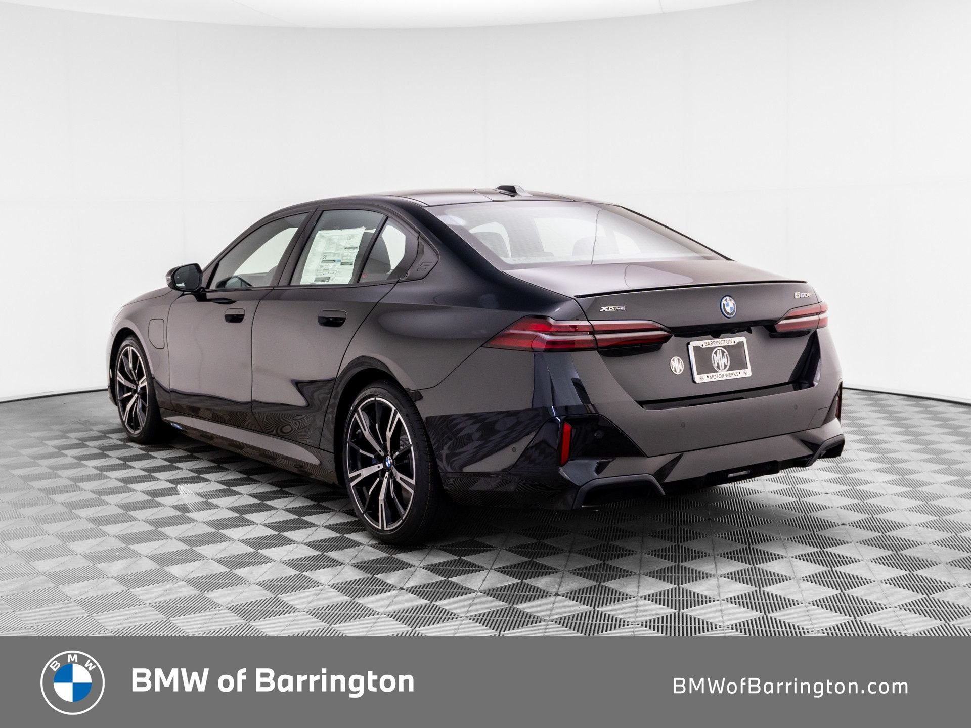 New 2027 Black Sapphire Metallic BMW 550e xDrive image 3