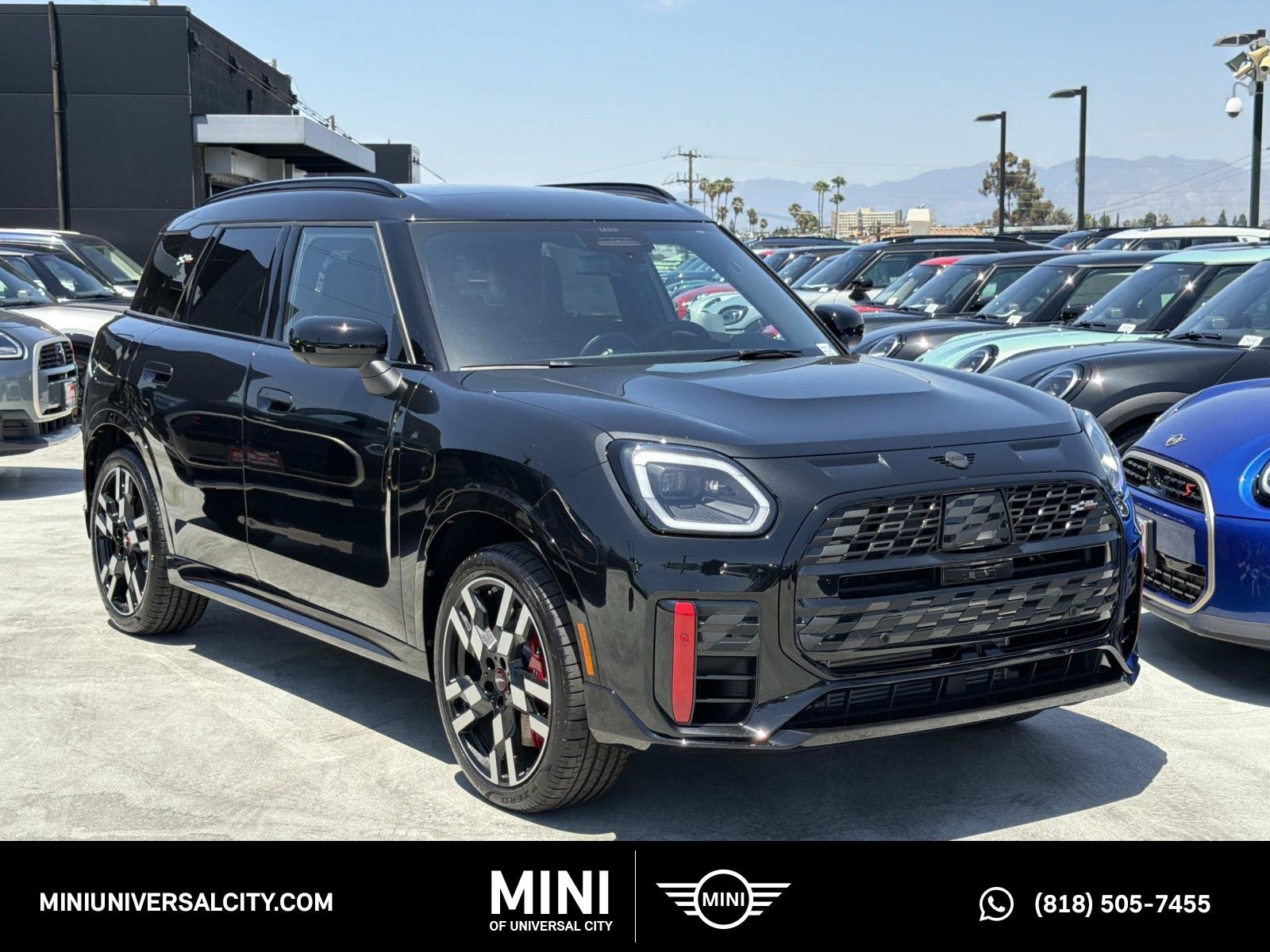 New 2027 0C4R Midnight Black II Metallic MINI Iconic image 1