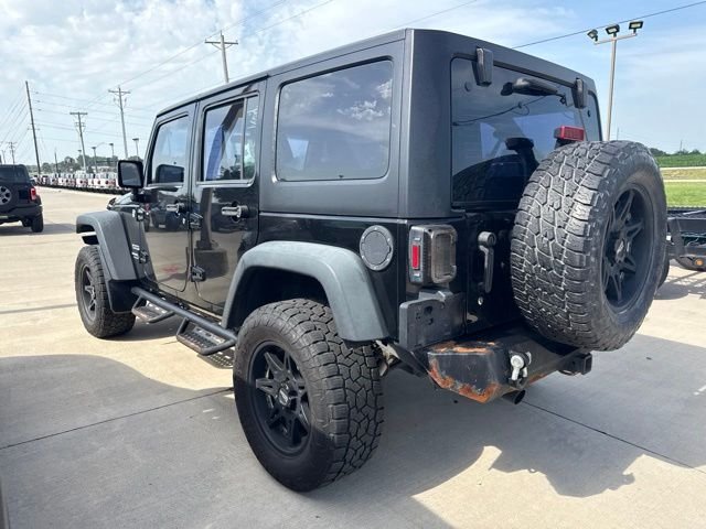 Used 2013 Black Jeep Unlimited Sport image 3