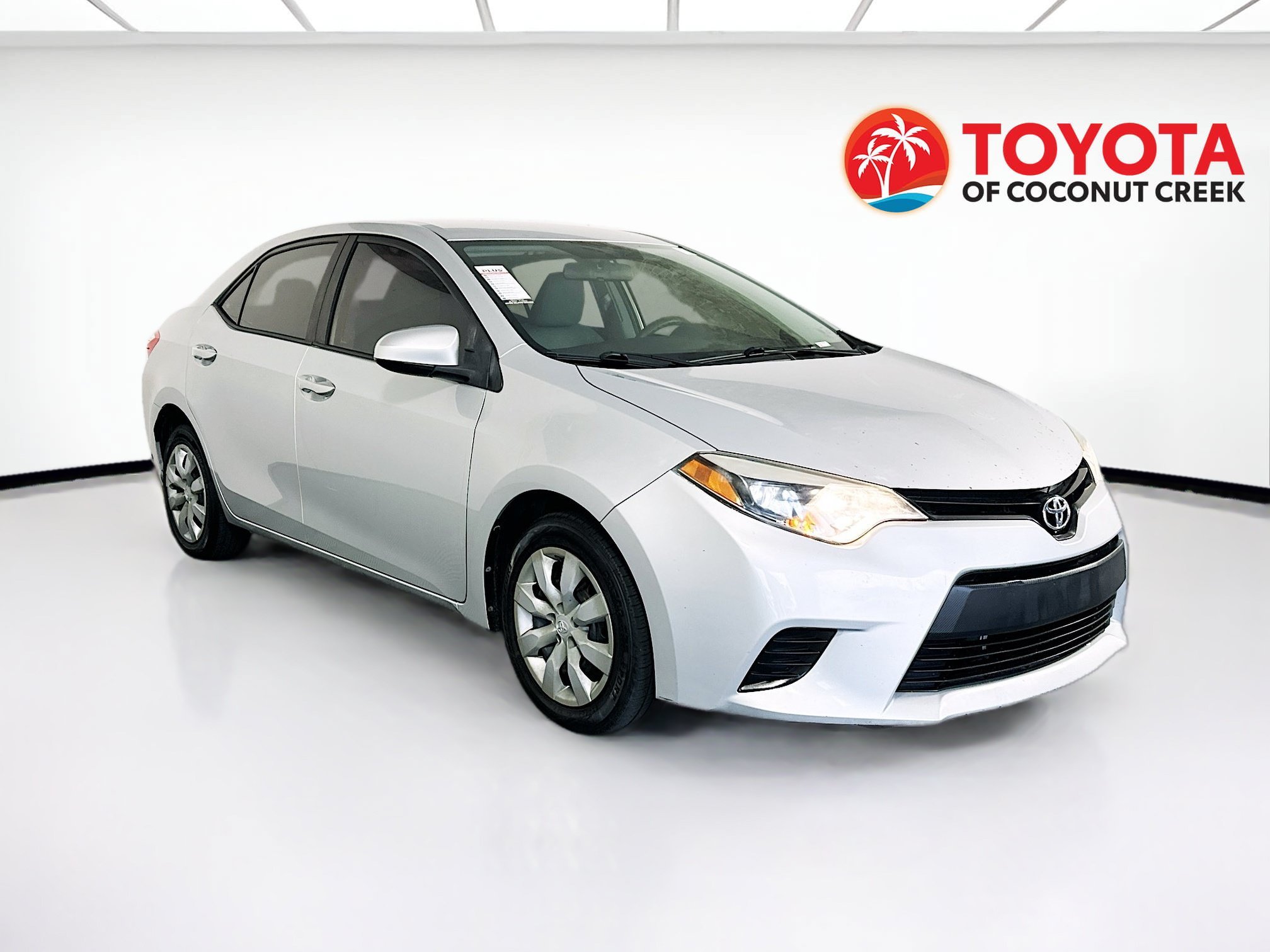 Used 2014 Classic Silver Metallic Toyota LE image 1