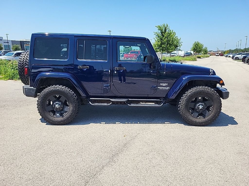 Used 2013 Blue Jeep Unlimited Sahara image 6