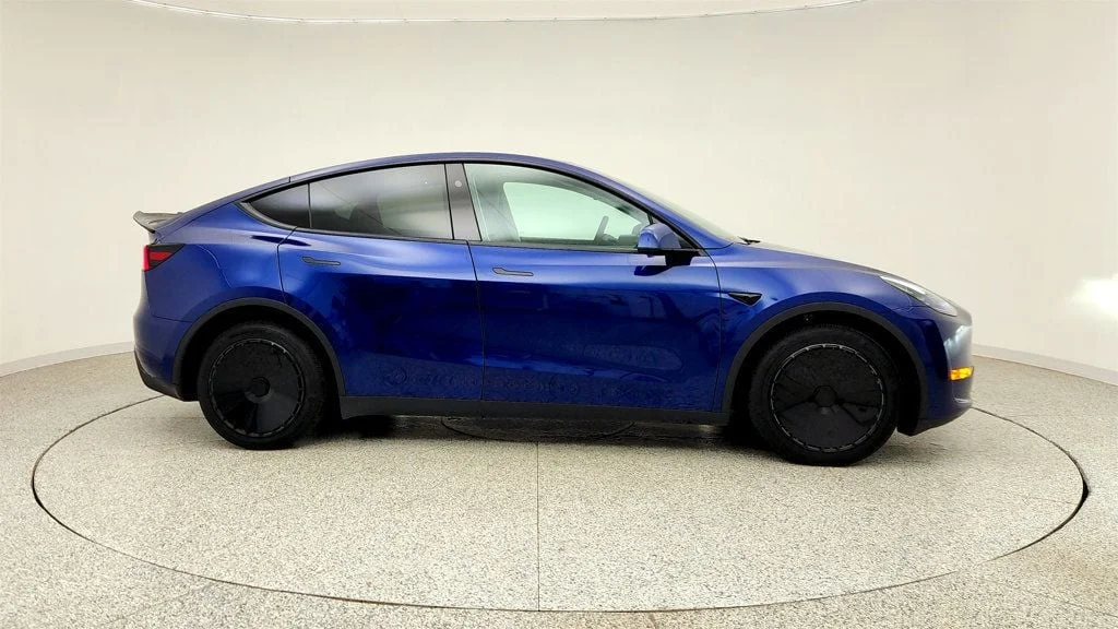 Used 2024 Deep Blue Metallic Tesla Long Range AWD w/ Full Self-Driving & Aero Disc Wheel Covers image 4