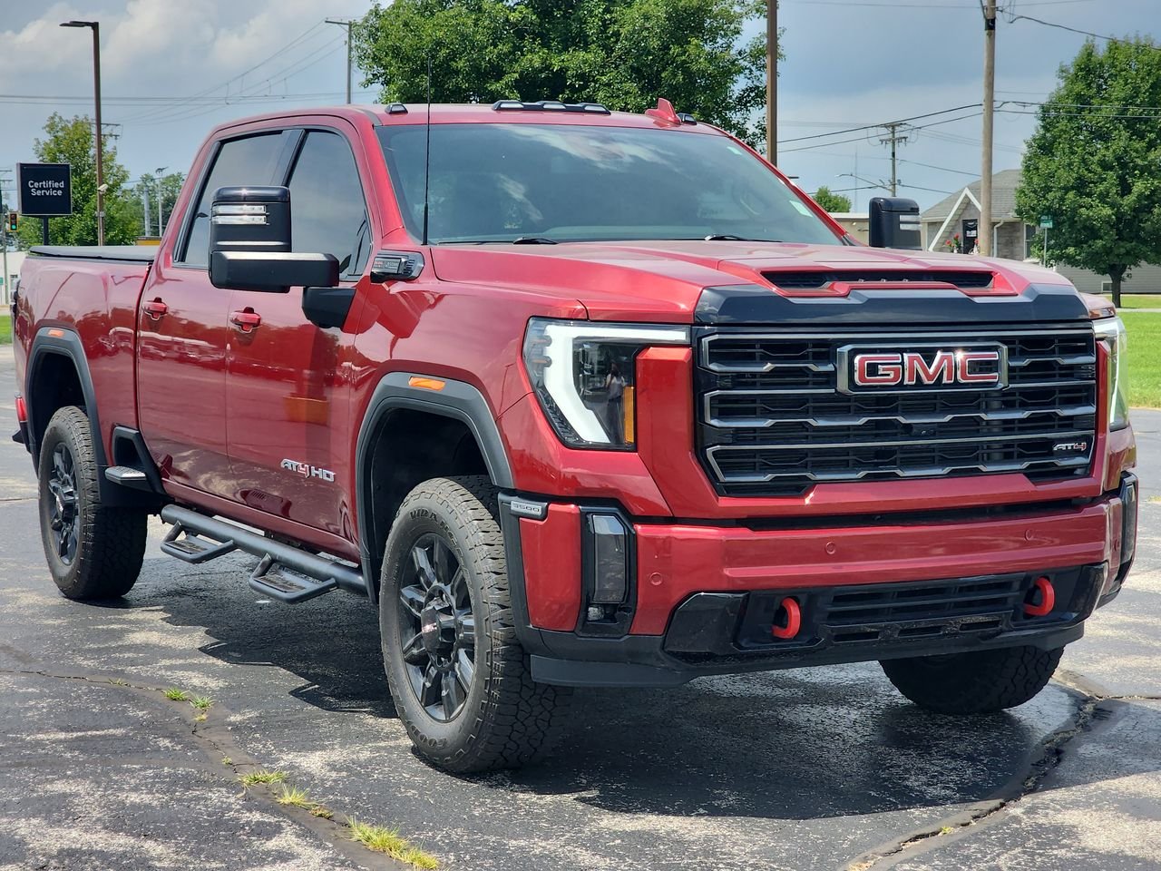 Used 2024 Volcanic Red Tintcoat GMC AT4 image 1