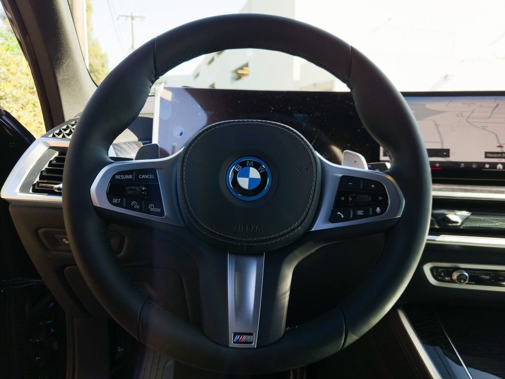 New 2026 Black Sapphire Metallic BMW xDrive50e image 11