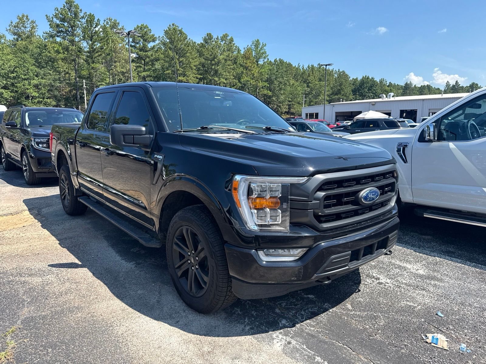 Used 2021 Agate Black Metallic Ford XLT image 1