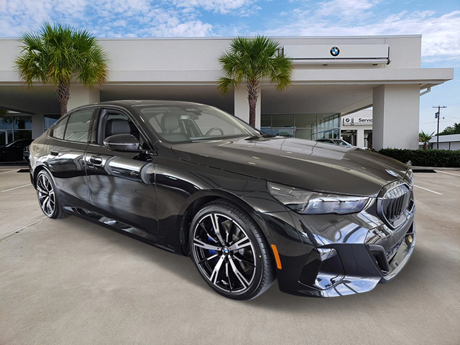 New 2027 Black Sapphire Metallic BMW 550e xDrive image 3