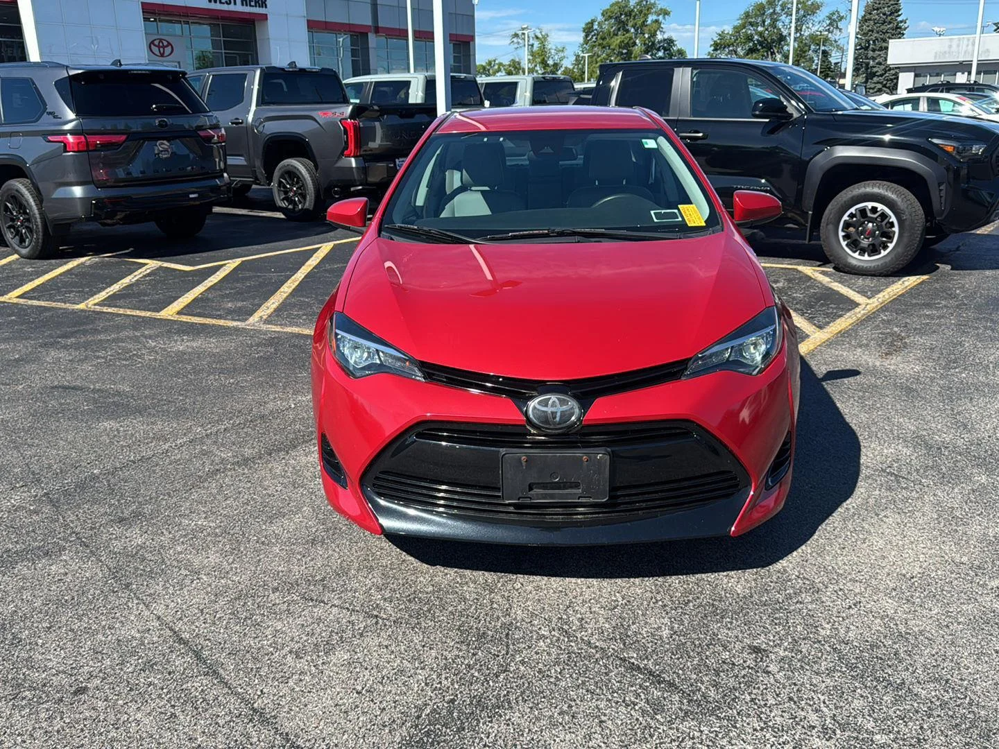 Used 2018 Barcelona Red Metallic Toyota LE image 2