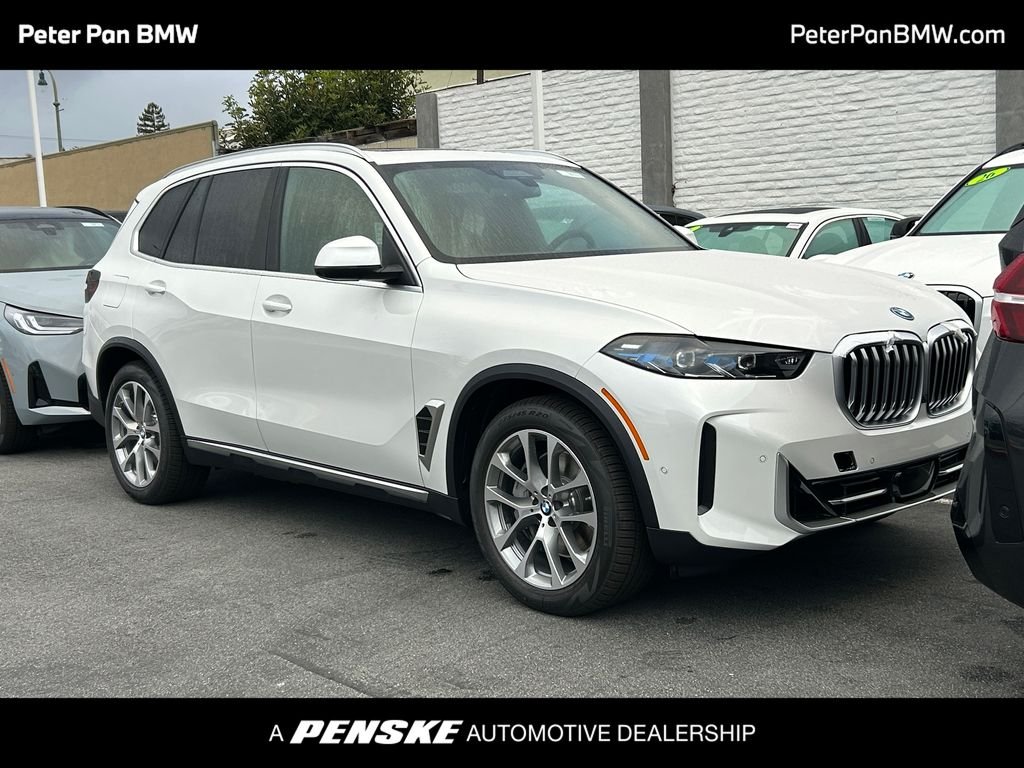 New 2026 Mineral White Metallic BMW xDrive50e image 1