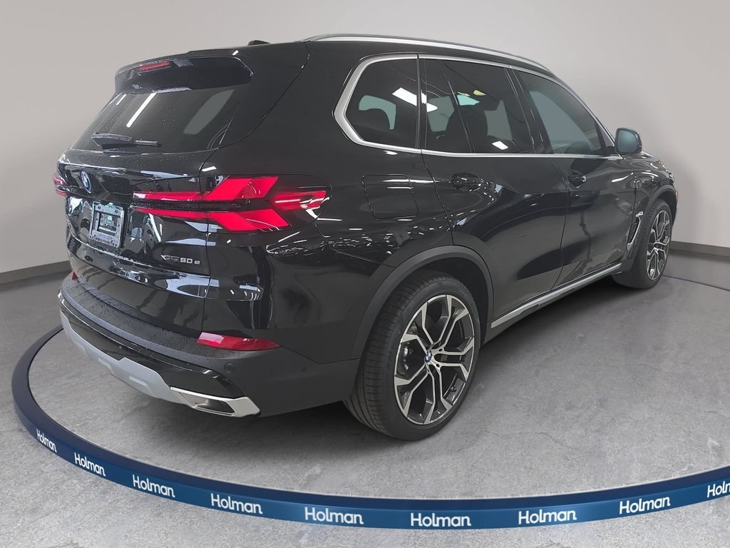 New 2026 Black Sapphire Metallic BMW xDrive50e image 4