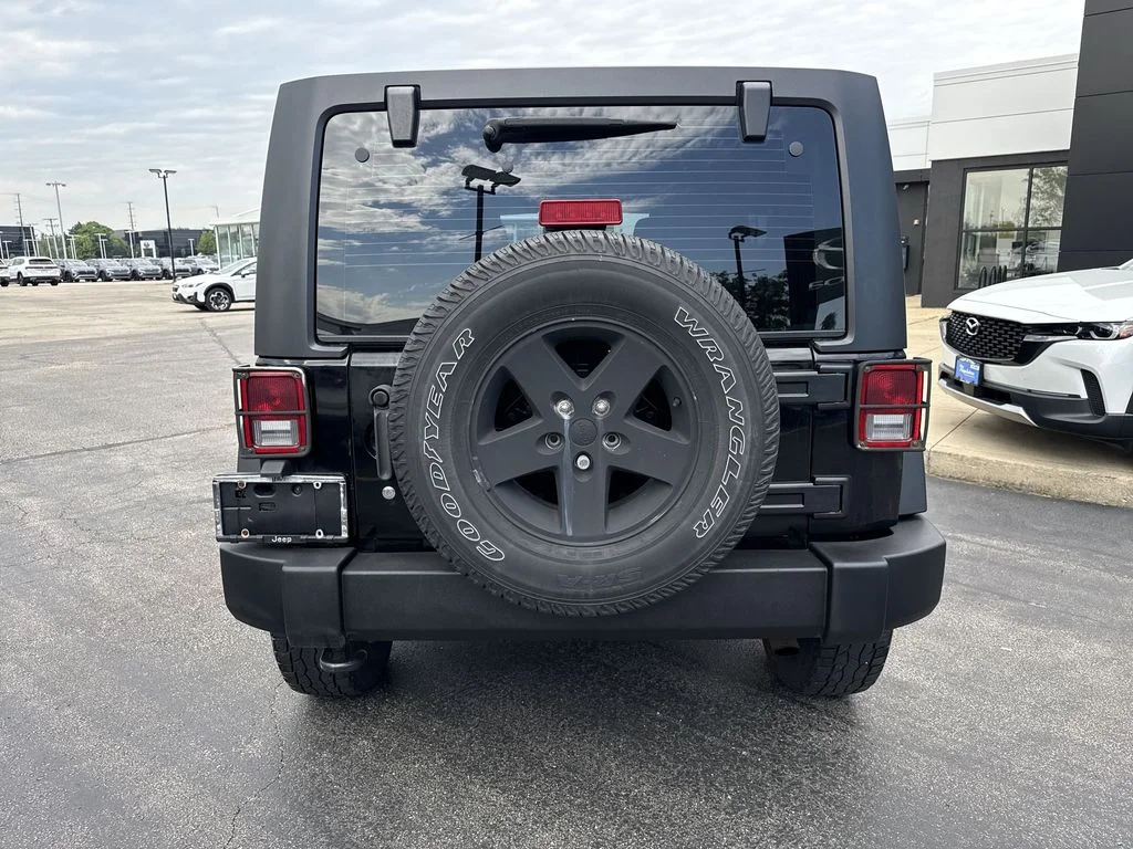 Used 2013 Black Jeep Unlimited Sport image 2
