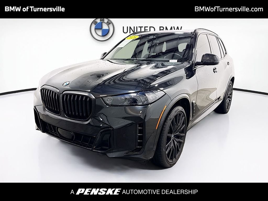 Certified Used 2025 Black Sapphire Metallic BMW xDrive40i image 1